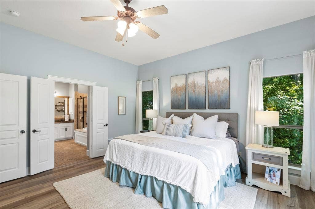 6810 Trinity Falls Parkway, McKinney, TX 75071 Wood-finish flooring with a ceiling fan