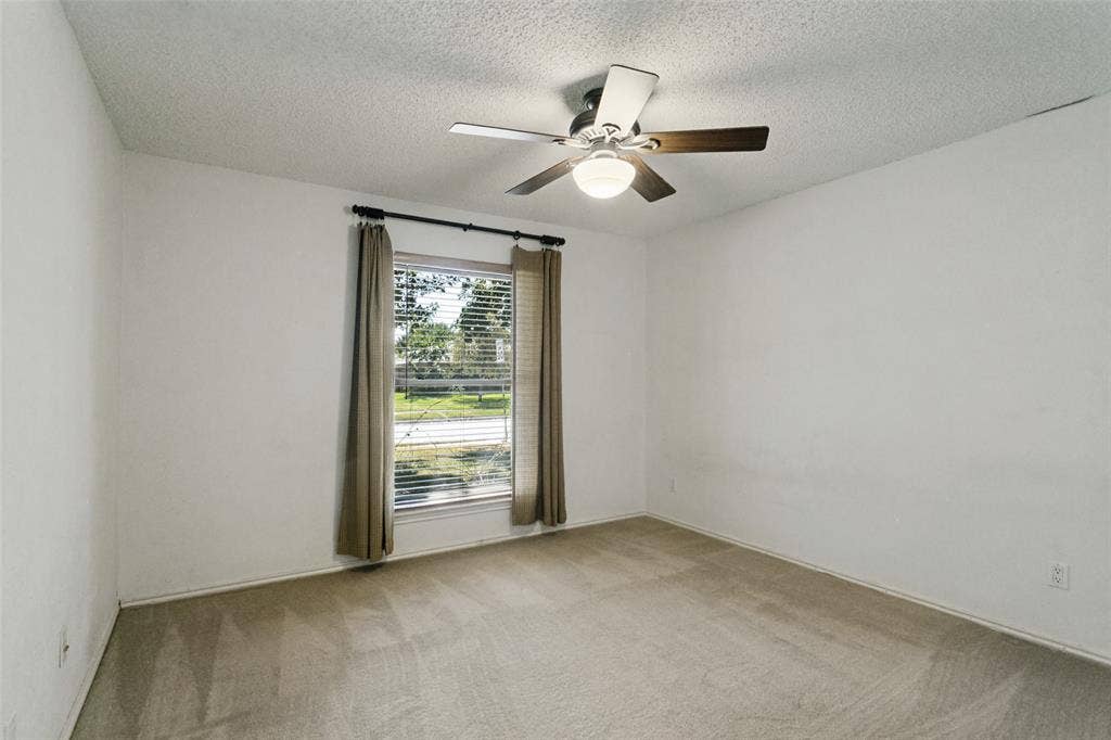 2717 Pinehurst Drive, Plano, TX 75075 Window with horizontal blinds and drapes, ceiling fan with light fixture, and carpeted flooring