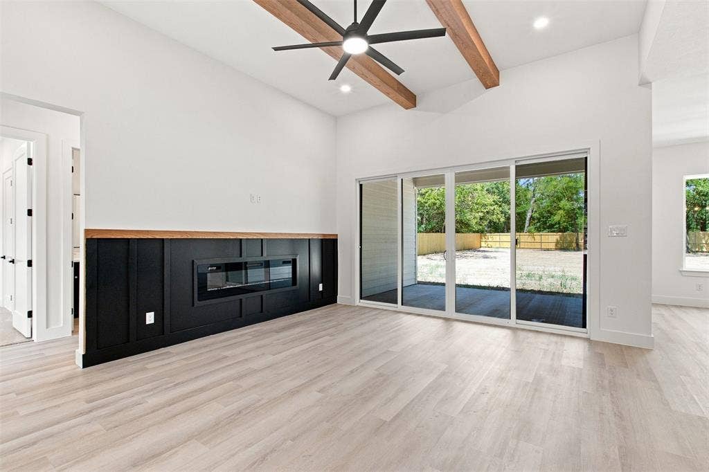3023 Mallory Drive, Dallas, TX 75216 Vaulted ceilings with exposed wood beams, a contemporary ceiling fan, and recessed lighting