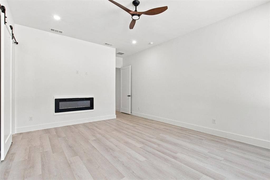 3023 Mallory Drive, Dallas, TX 75216 Recessed lighting and a ceiling fan with wood-finish blades