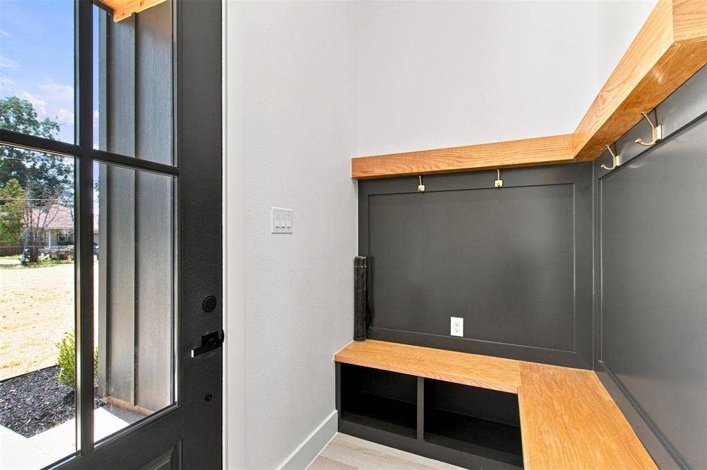 3023 Mallory Drive, Dallas, TX 75216 Entry with built-in bench seating, storage cubbies, and wall-mounted coat hooks