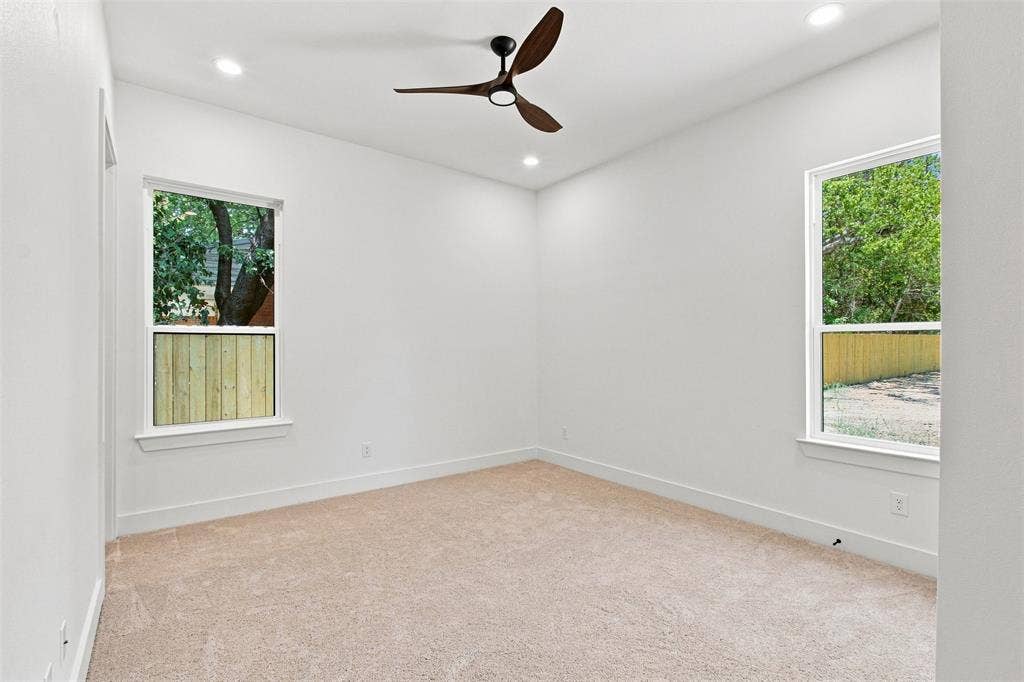 3023 Mallory Drive, Dallas, TX 75216 Recessed lighting, wood-finish ceiling fan, two windows, wall-to-wall carpeting, and white trim