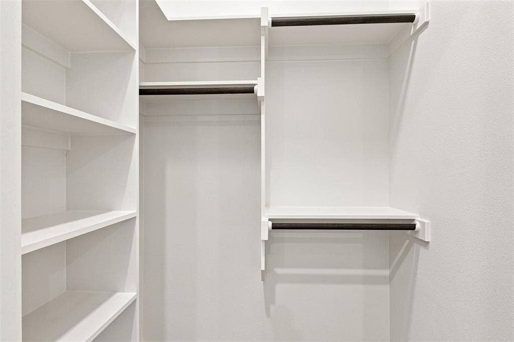 3023 Mallory Drive, Dallas, TX 75216 Built-in shelving and hanging rods with a white finish