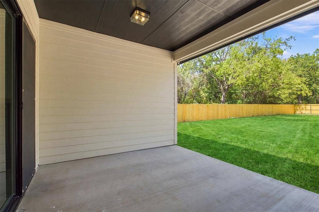 3023 Mallory Drive, Dallas, TX 75216 Covered patio with concrete flooring, plank siding, and integrated ceiling lighting