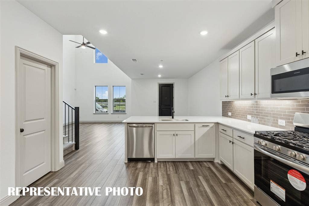 4755 Lunker Street, McKinney, TX 75071 The kitchen peninsula with breakfast bar makes this the perfect place to grab a quick bite. REPRESENTATIVE PHOTO