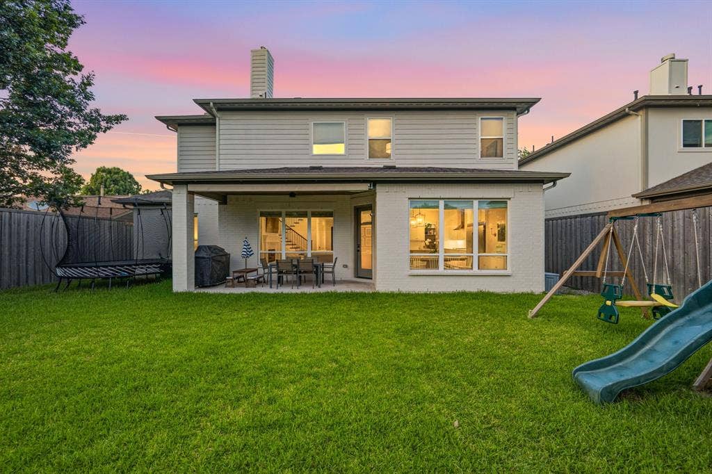 559 Coolair Drive, Dallas, TX 75218 Backyard with large grassy area