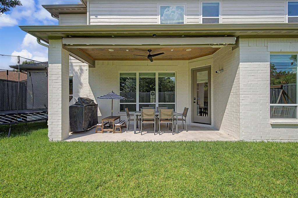 559 Coolair Drive, Dallas, TX 75218 Back porch with retractable sunshade