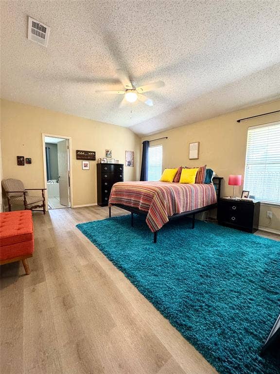 5512 Vineyard Lane, McKinney, TX 75070 Vaulted ceiling, ceiling fan, wood-finish flooring, two windows with blinds, interior door