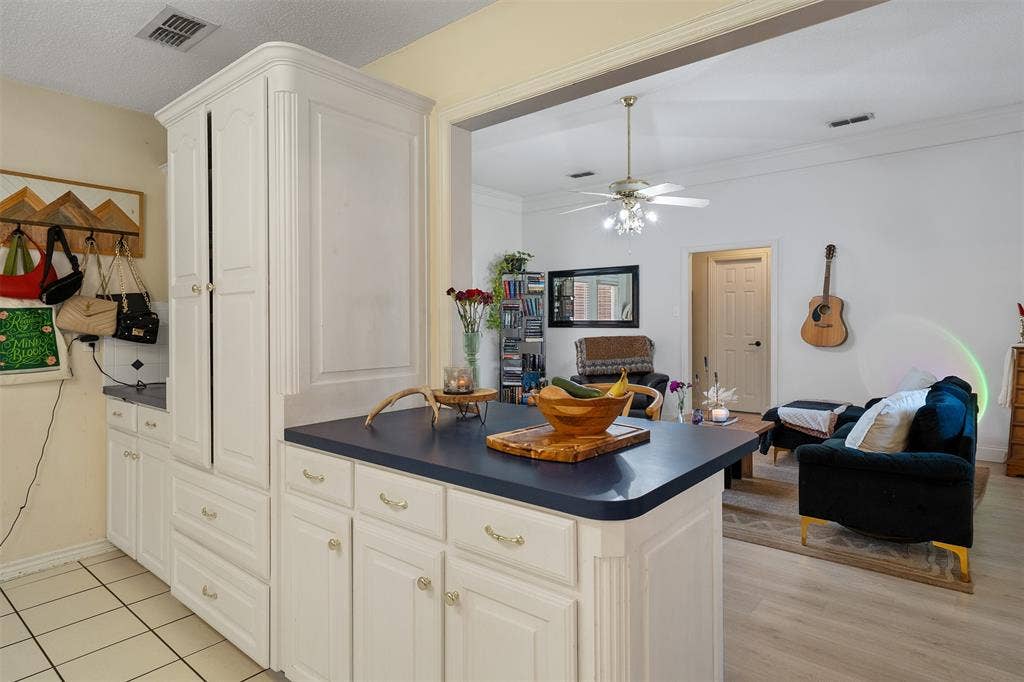 310 Linda Lane, Lindale, TX 75771 White cabinetry with paneled doors and gold-toned hardware
