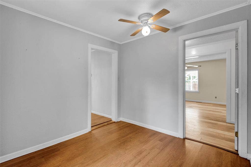3572 State Highway 110 N, Tyler, TX 75704 Hardwood-finish flooring throughout, light gray wall paint, and a ceiling fan with integrated lighting