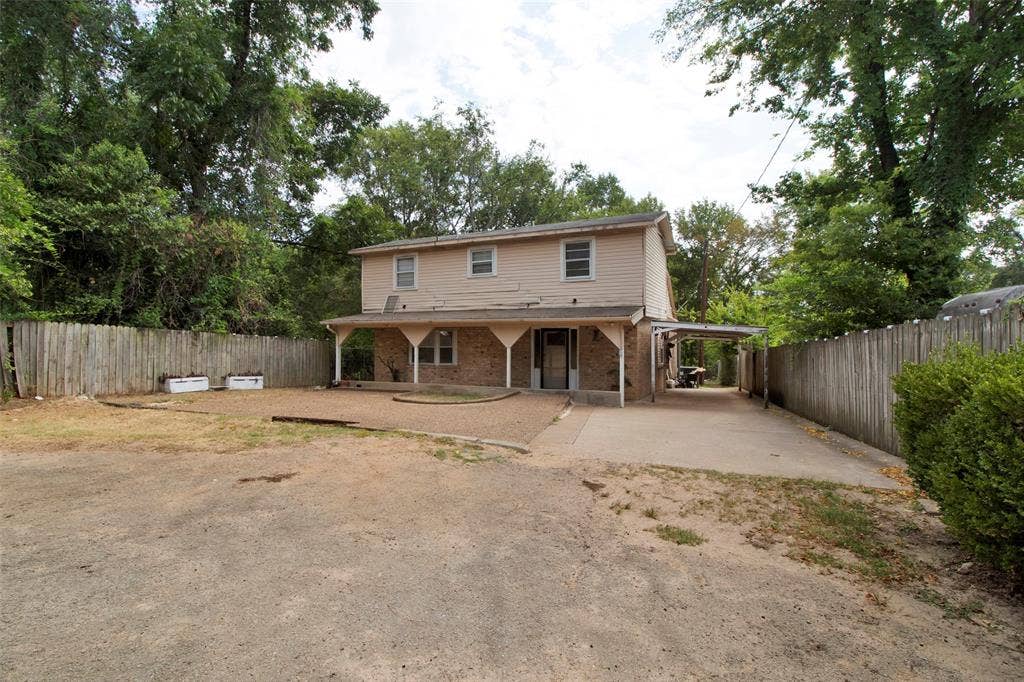 3572 State Highway 110 N, Tyler, TX 75704 Two-story residence featuring a brick facade on the lower level and siding on the upper level