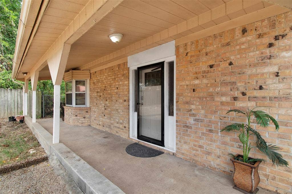 3572 State Highway 110 N, Tyler, TX 75704 Brick exterior with a covered porch, bay window, and a glass-paneled entry door
