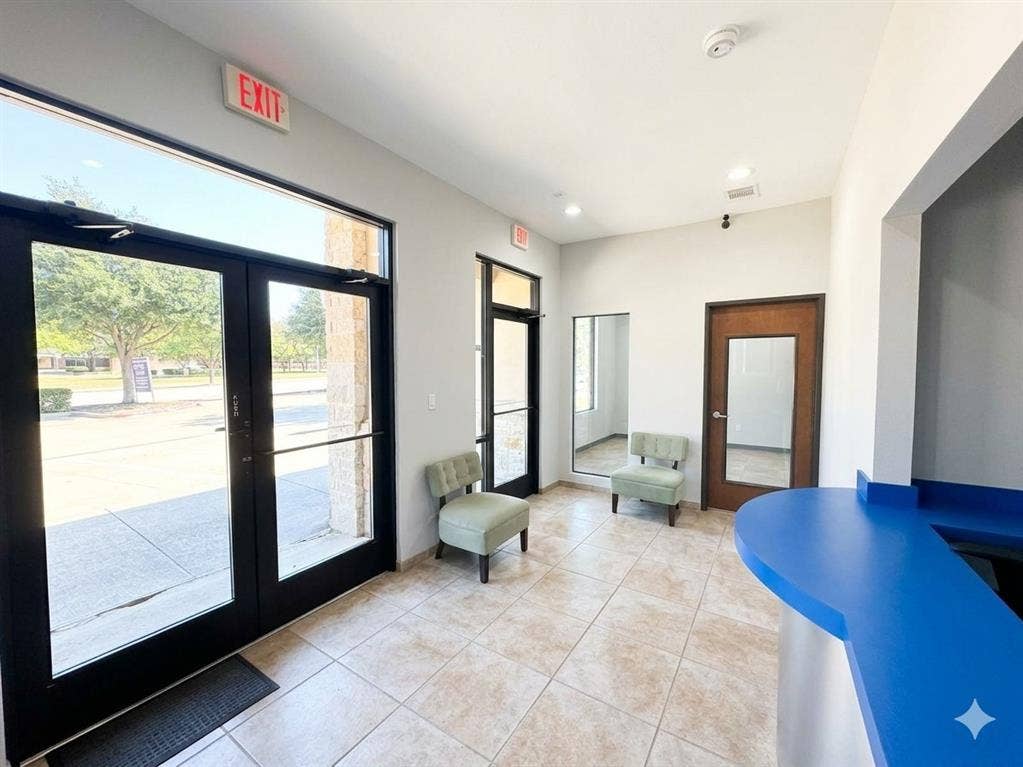 4512 Legacy Drive, #100, Plano, TX 75024 Tile flooring, expansive glass entry doors, recessed lighting, and a built-in reception desk