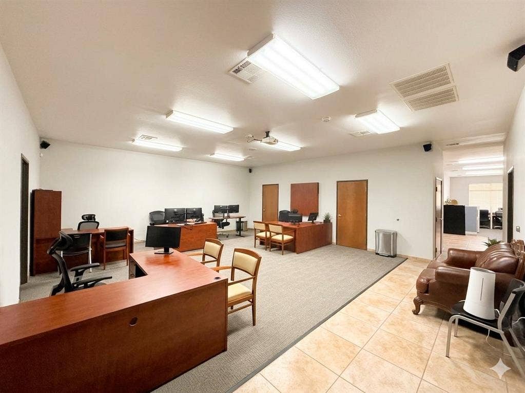 4512 Legacy Drive, #100, Plano, TX 75024 Spacious open-concept commercial interior featuring recessed lighting, projector, multiple private offices, tile flooring, and carpeted work areas