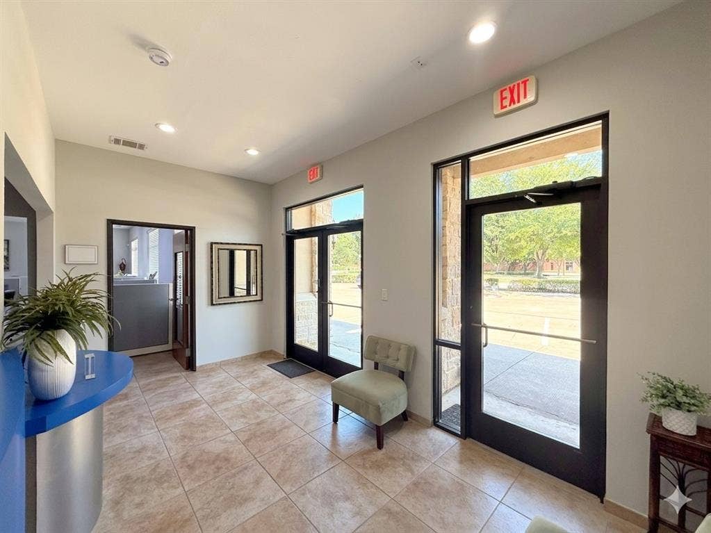 4512 Legacy Drive, #100, Plano, TX 75024 Recessed ceiling lighting illuminates the tiled flooring and glass entry doors