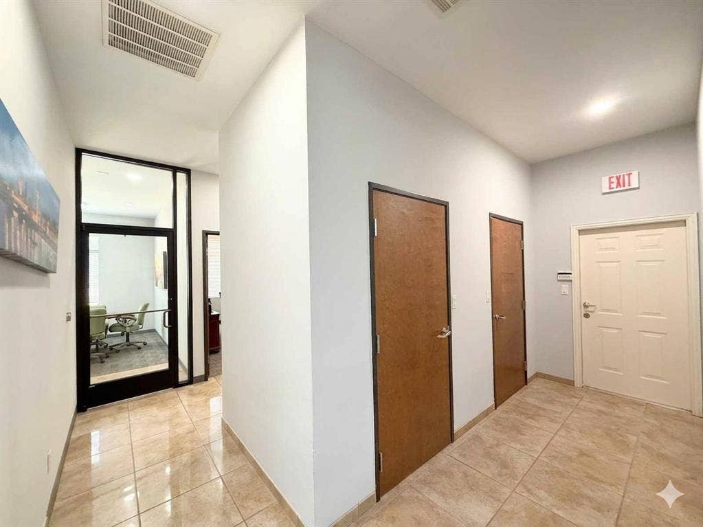 4512 Legacy Drive, #100, Plano, TX 75024 Recessed ceiling lighting, tiled flooring, glass-paneled office entrance, wood-finish doors, and white paneled door