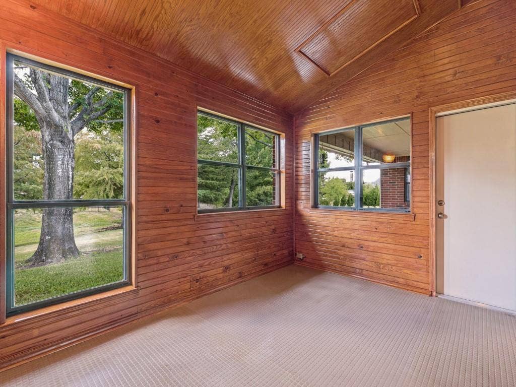 26 Lago Vista W, Wylie, TX 75098 Sunroom with durable flooring, overlooking back yard and pond.