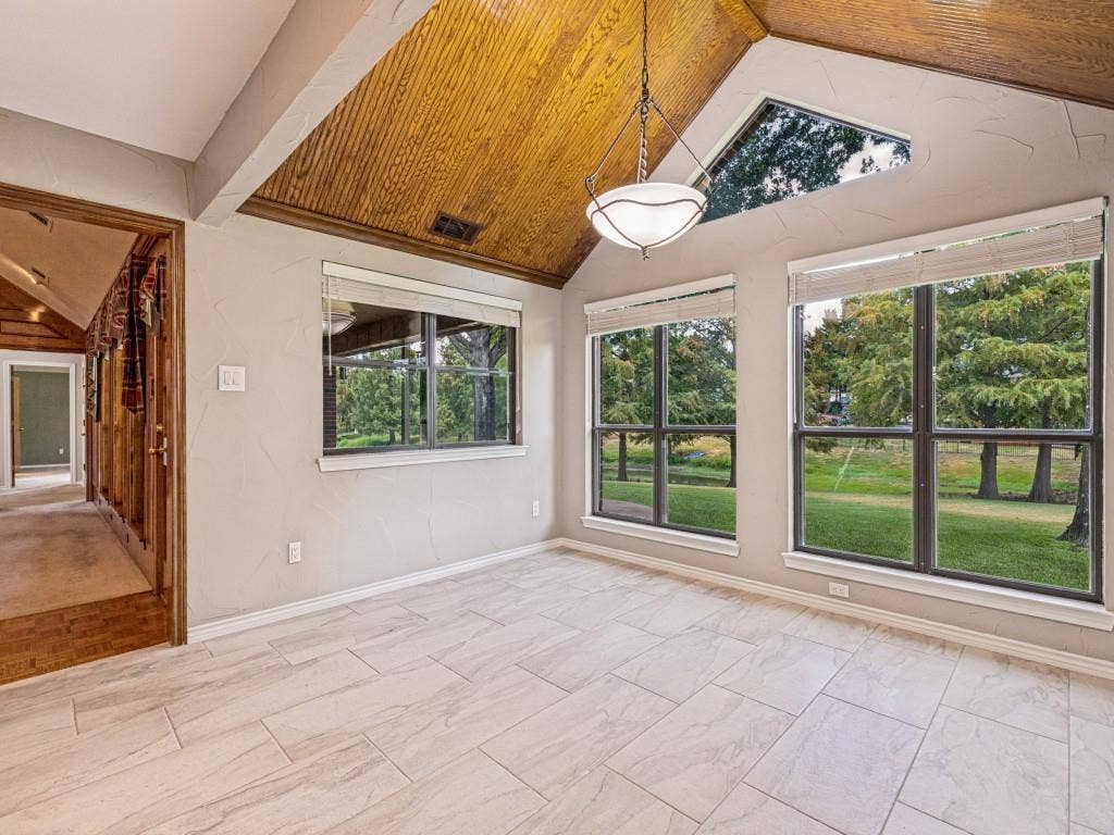 26 Lago Vista W, Wylie, TX 75098 Open dining area with tile, overlooking backyard and pond.