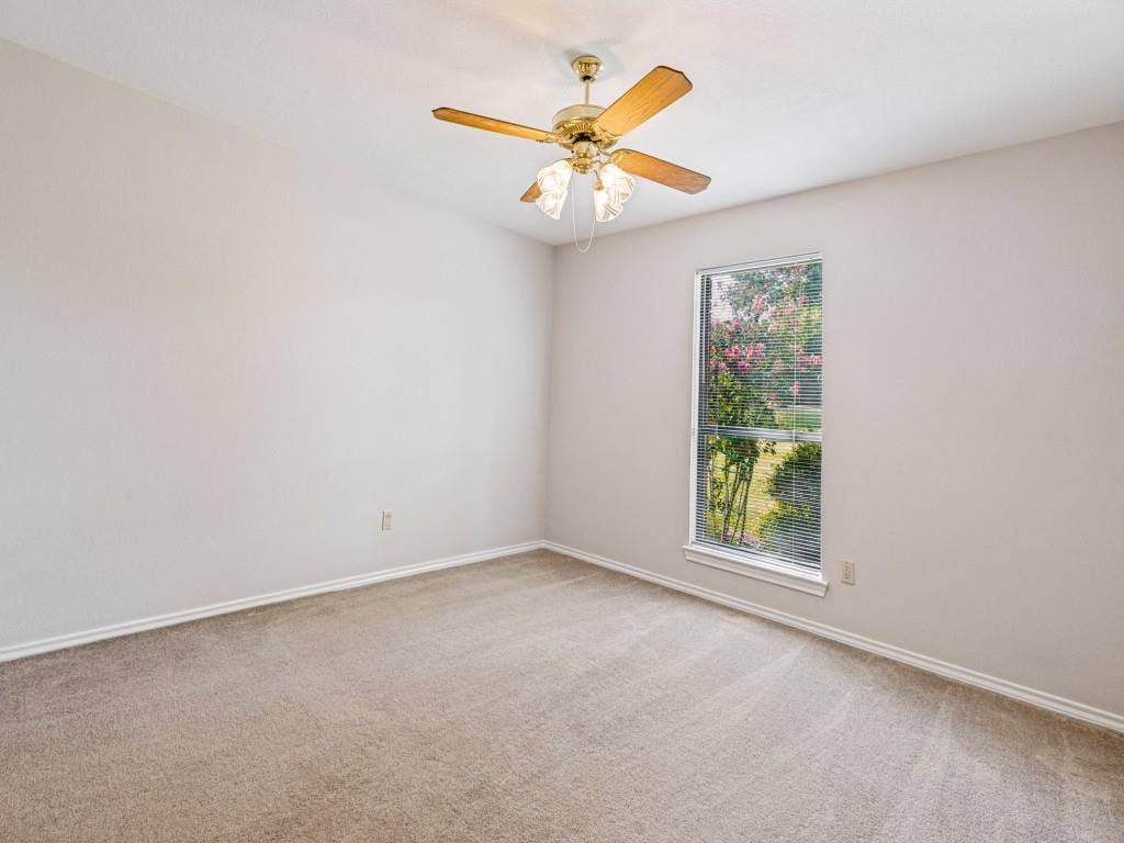 26 Lago Vista W, Wylie, TX 75098 Wall-to-wall carpeting, ceiling fan with light fixture, and window with natural light