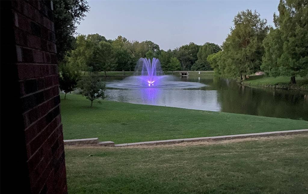 26 Lago Vista W, Wylie, TX 75098 Fountain is lit up at night with varying colors.