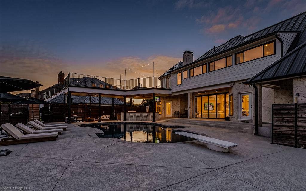 28 Victoria Drive, Rowlett, TX 75088 Stamped concrete pool deck with an irregular shape pool