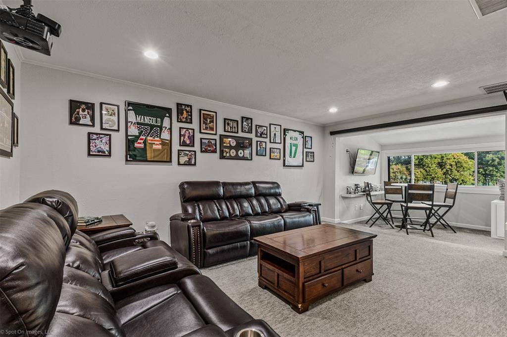 28 Victoria Drive, Rowlett, TX 75088 Recessed lighting illuminates the carpeted floor and painted walls