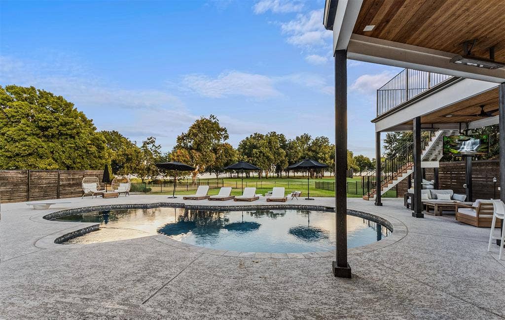 28 Victoria Drive, Rowlett, TX 75088 Custom-shaped swimming pool with textured concrete decking