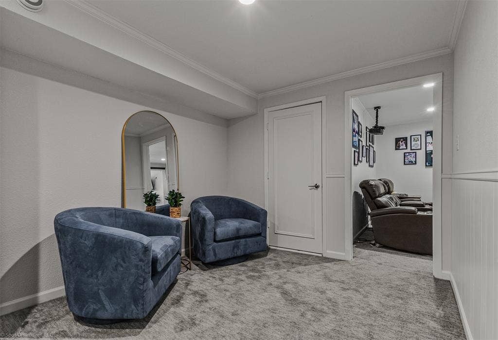 28 Victoria Drive, Rowlett, TX 75088 Arch-top mirror with a metallic frame, recessed ceiling lighting, and crown molding