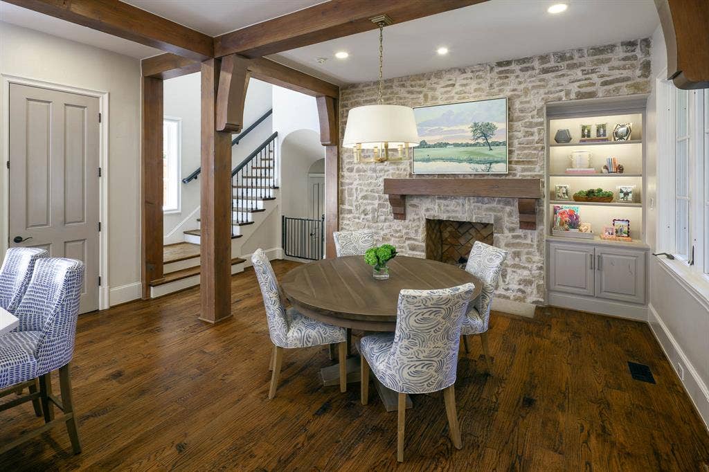 3637 Haynie Avenue, University Park, TX 75205 Breakfast room with gas fireplace, stone wall, and built-in shelving