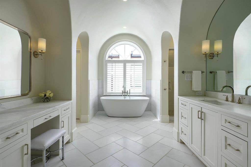 3637 Haynie Avenue, University Park, TX 75205 Primary bathroom with dual vanities, stand alone tub, and dual large walk-in closets
