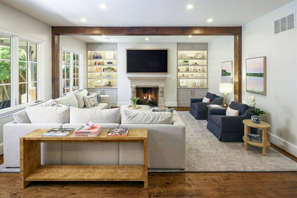 3637 Haynie Avenue, University Park, TX 75205 Living room with lgas fireplace, wood beamed ceiling, and built-in cabinetry and shelving