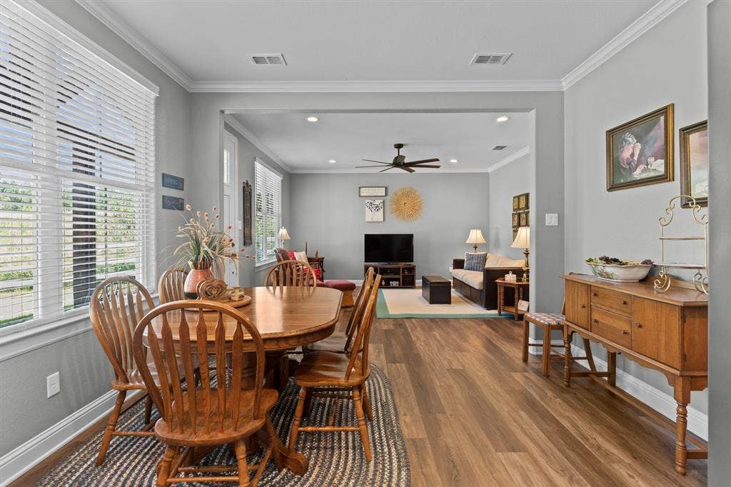 16713 Creek Bottom Court, Winona, TX 75792 Open-concept design with crown molding, recessed lighting, wood-finish flooring, and multiple windows
