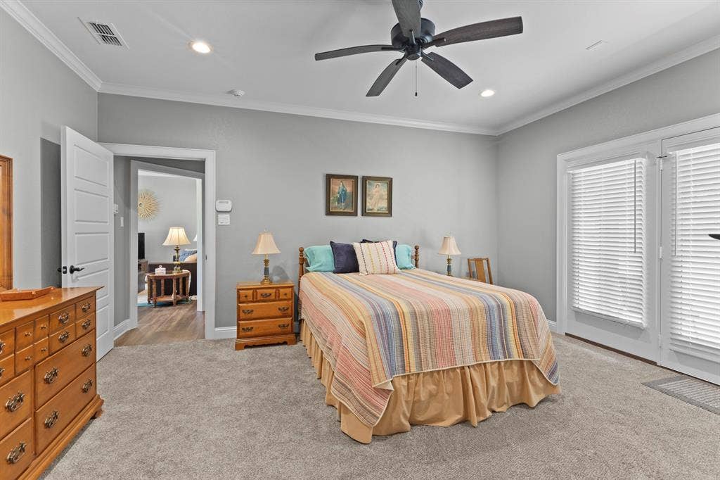 16713 Creek Bottom Court, Winona, TX 75792 Light gray wall paint, crown molding, ceiling fan with light, recessed lighting, and white door trim