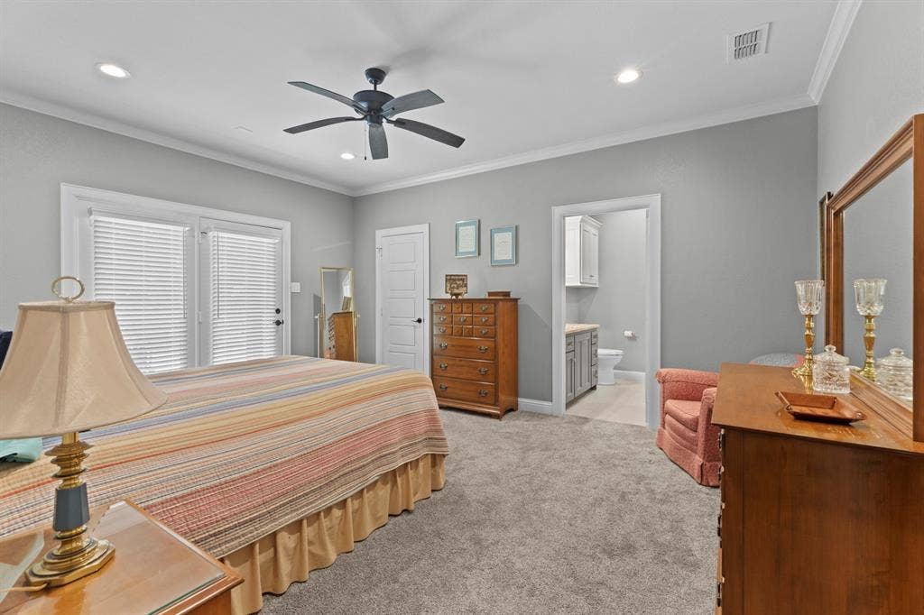 16713 Creek Bottom Court, Winona, TX 75792 Recessed lighting, crown molding, double French doors, ceiling fan, and carpet flooring