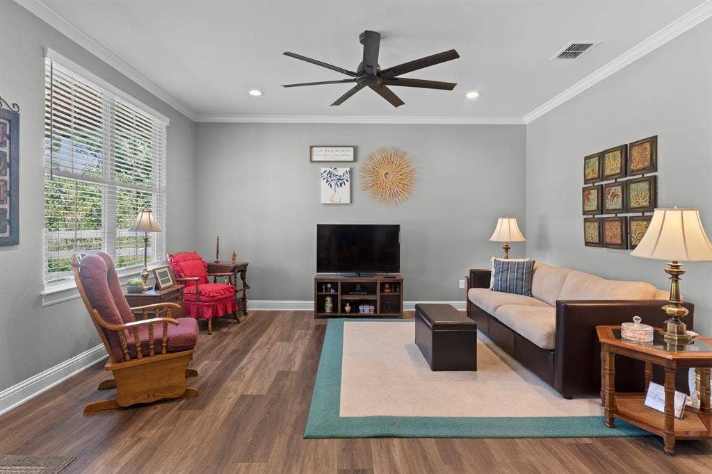 16713 Creek Bottom Court, Winona, TX 75792 Wood-finish flooring throughout, complemented by a ceiling fan with integrated lighting