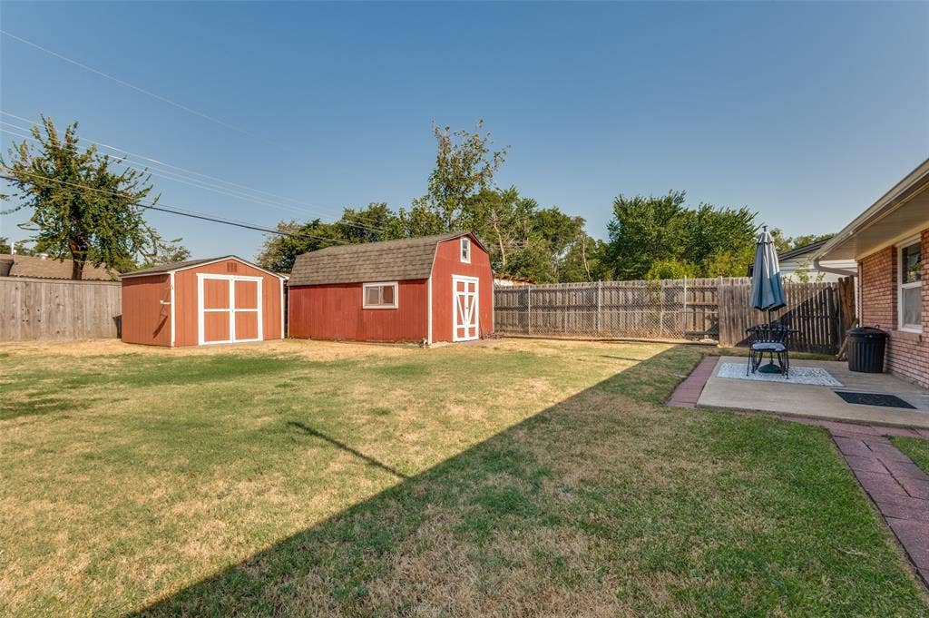 1726 Dorothy Drive, Grand Prairie, TX 75051 Backyard with 2 storage buildings