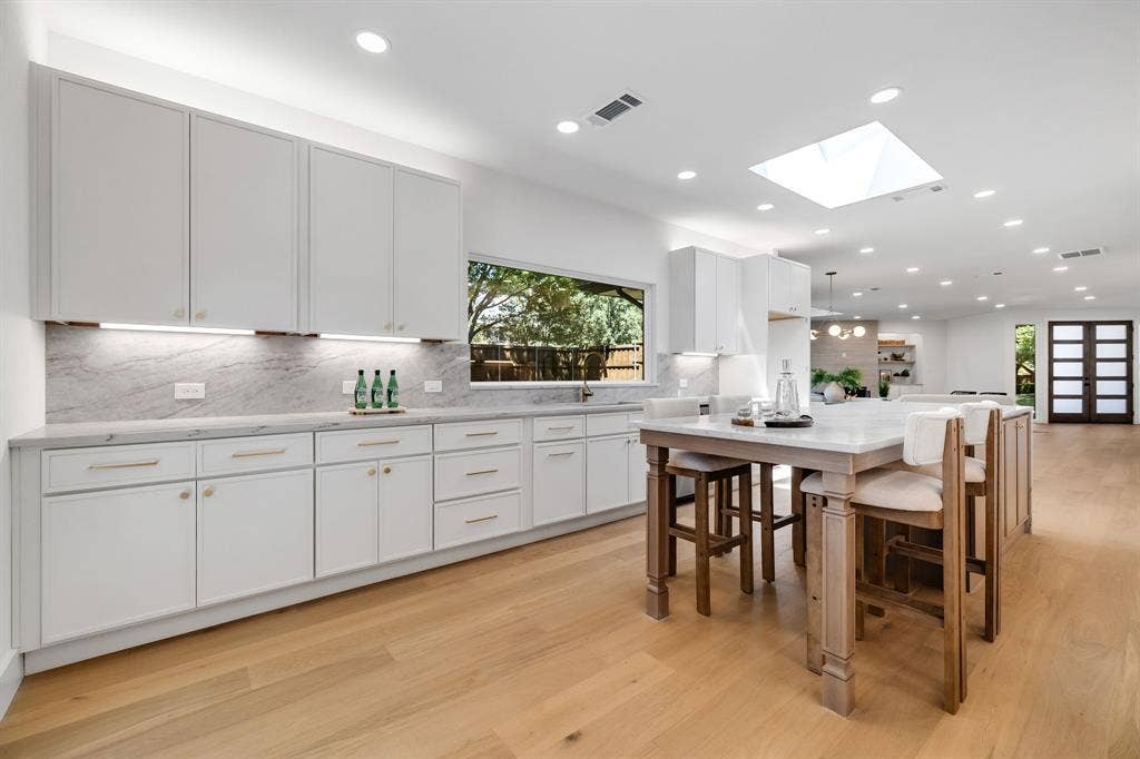 4402 Briargrove Lane, Dallas, TX 75287 4402 Briargrove-Bright designer kitchen highlighted by a custom picture window that fills the space with natural light.