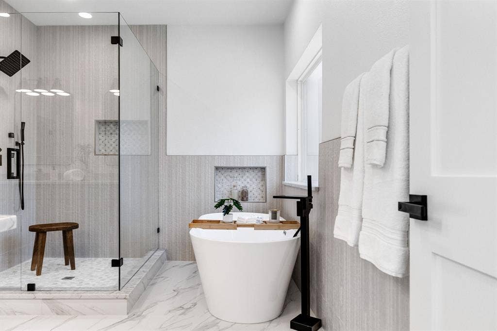 4402 Briargrove Lane, Dallas, TX 75287 4402 Briargrove-Freestanding soaking tub paired with a sleek floor-mounted matte black faucet.