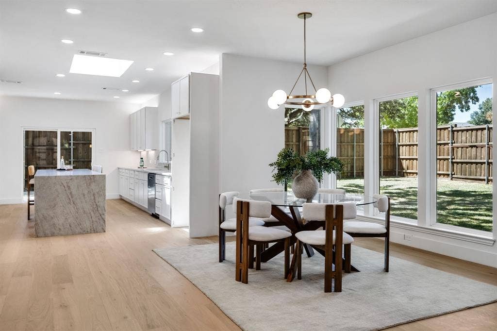 4402 Briargrove Lane, Dallas, TX 75287 4402 Briargrove-Elegant dining room anchored by a statement designer chandelier