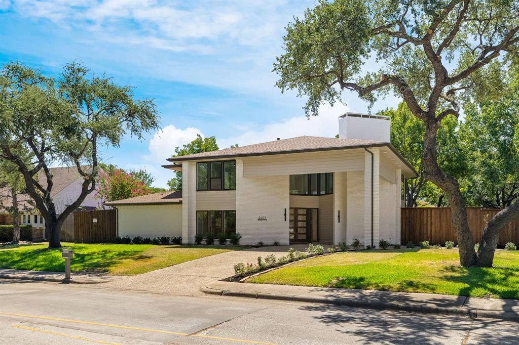 4402 Briargrove Lane, Dallas, TX 75287 4402 Briargrove- ight-toned brick exterior complemented by warm horizontal wood-finish siding accents.