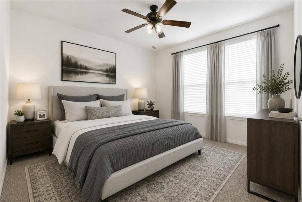 A clean angle reveals plush carpet, soft natural light, and a stylish ceiling fan fixture in this flexible secondary bedroom. Enjoy configuring this quiet, inviting space into a dream nursery, guest retreat, or personal studio. *Virtually Staged*
