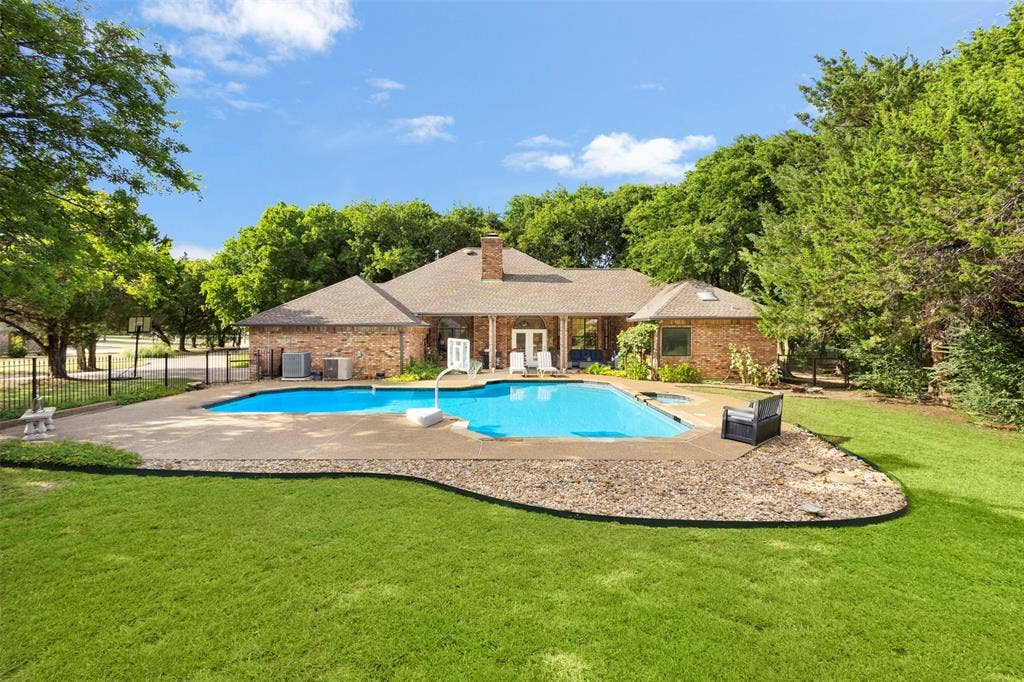 Brick exterior with a gabled roof and chimney
