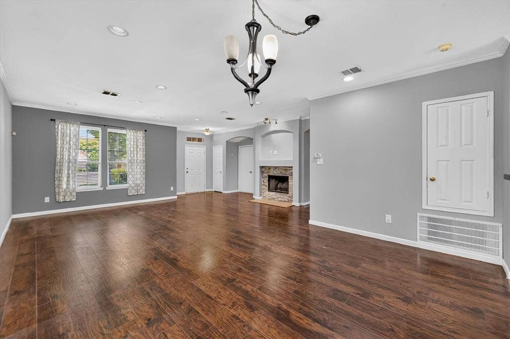 6513 Cartier Court, McKinney, TX 75072 Wood-finish flooring throughout, recessed lighting, and a stone-faced fireplace