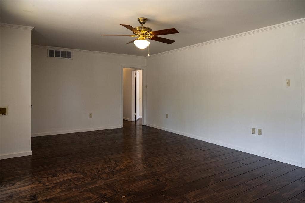 3807 Huaco Lane, Waco, TX 76710 Wood-finish flooring, white walls, and a ceiling fan with integrated lighting