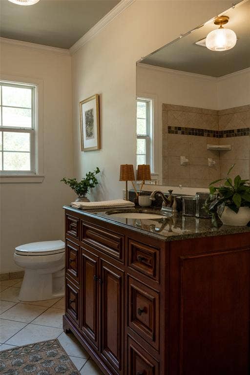 3807 Huaco Lane, Waco, TX 76710 Dark wood-finish vanity with an undermount sink and stone countertop