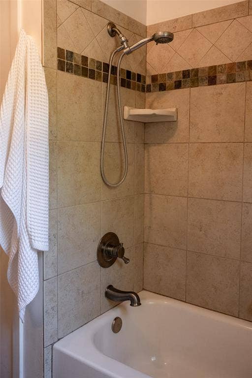 3807 Huaco Lane, Waco, TX 76710 Tiled shower surround with decorative mosaic accent band