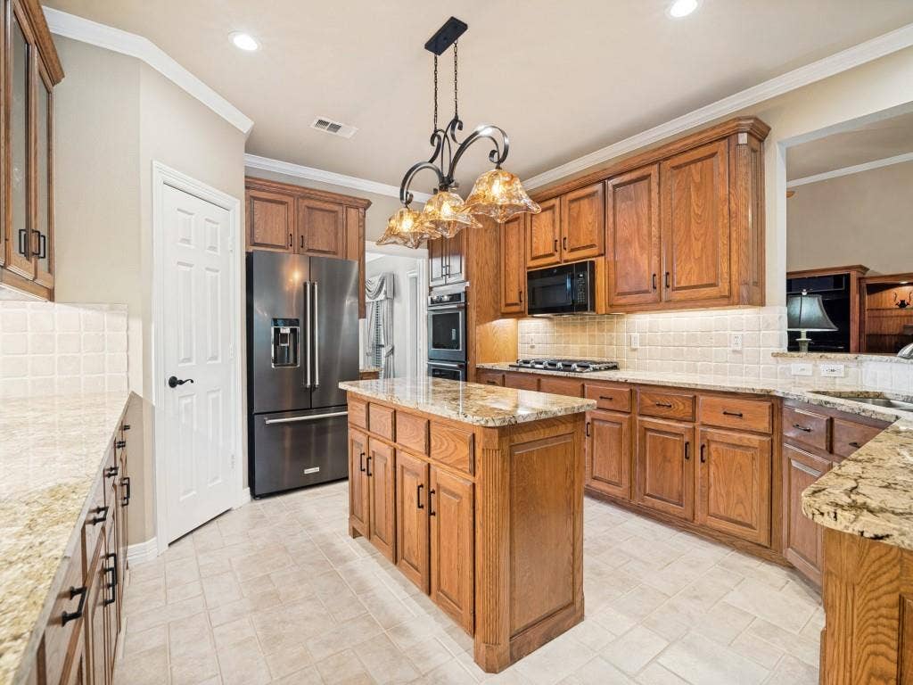 103 Texas Circle, Sunnyvale, TX 75182 Gas cooktop, double convection oven, built-in microwave, walk-in pantry and recessed lighting are some of the additional features of the kitchen.