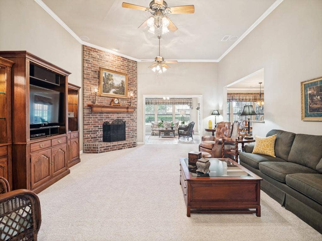 103 Texas Circle, Sunnyvale, TX 75182 Oversized living room features a floor to ceiling fireplace with open views to the sunroom and kitchen.