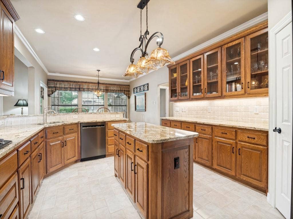 103 Texas Circle, Sunnyvale, TX 75182 Spacious kitchen boasts granite countertops, decorator lighting and massive amounts of storage.