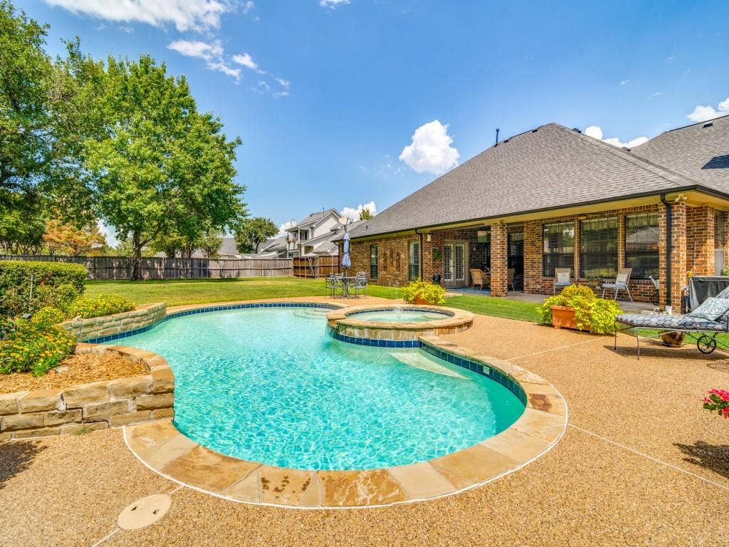 103 Texas Circle, Sunnyvale, TX 75182 View from the pool towards the extended covered patio.